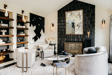 This is an example of a transitional living room in San Francisco with white walls, dark hardwood floors, a standard fireplace, a tile fireplace surround and black floor.