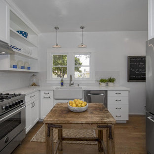 Small rustic kitchen pantry designs - Small mountain style l-shaped kitchen pantry photo in Santa Barbara