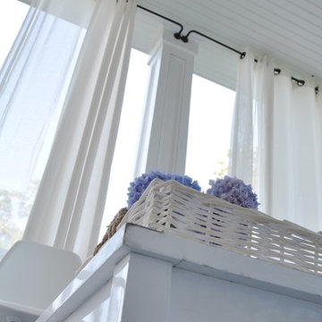 Create a stylish front porch with outdoor curtains