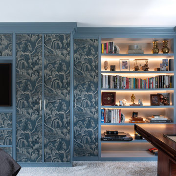 Bespoke fitted wardrobes with wallpapered panels