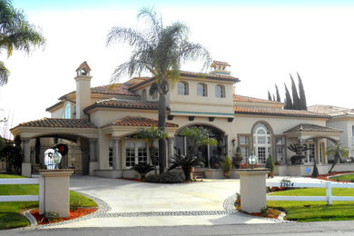 Example of a tuscan home design design in Orange County
