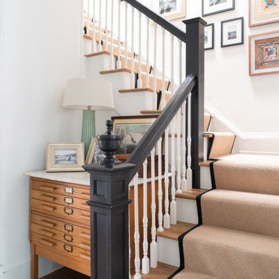 Staircase - transitional carpeted l-shaped wood railing staircase idea in Jacksonville with carpeted risers
