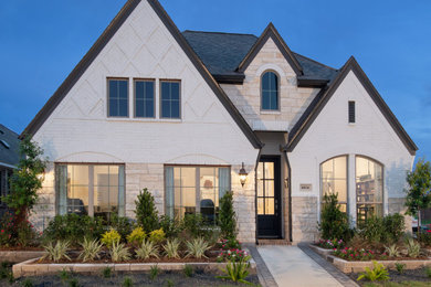 Inspiration for a white one-story mixed siding house exterior remodel in Houston