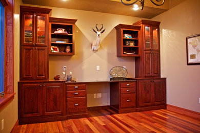 Inspiration for a mid-sized built-in desk home office remodel in Other