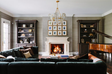 Large elegant open concept dark wood floor and brown floor family room photo in Chicago with multicolored walls, a standard fireplace, a concrete fireplace and a concealed tv
