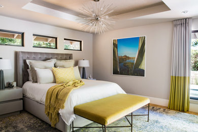 Mid-sized transitional guest bedroom in San Francisco with grey walls, medium hardwood floors and beige floor.