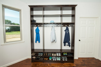 Example of a small classic light wood floor entryway design in Philadelphia with white walls and a white front door