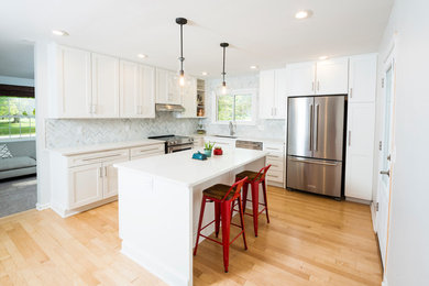 Inspiration for a transitional eat-in kitchen remodel in Indianapolis with an island