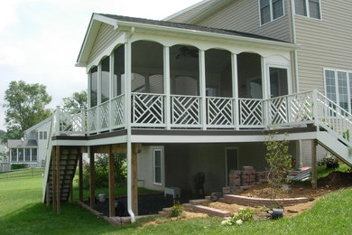 Example of a mid-sized classic backyard deck design in Baltimore with no cover