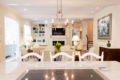 Large traditional open plan dining in Raleigh with white walls and medium hardwood floors.