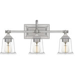 Quoizel Lighting - Quoizel Lighting - Nicholas 3 Light Transitional Bath Vanity - 10 Inches - Collection: Nicholas, Material: Steel, Finish Color: Brushed Nickel, Width: 22", Height: 10", Length: 7", Depth: 7", Backplate Width: 8", Backplate Length: 4.5", Lamping Type: Incandescent, Number Of Bulbs: 3, Wattage: 100 Watts, Dimmable: Yes, Moisture Rating: Damp Rated, Desc: The Nicholas collection gives a solid nod to mid century style. The streamlined silhouette is finished in Brushed Nickel, Polished Chrome, or Earth Black to compliment a variety of home styles. The tapered square glass shades gives this design an edge and it is complemented beautifully by the rectangular backplate. All bath fixtures can be mounted as uplights or downlights and are offered in several sizes.   Warranty: 1 Year   Room Style: Bathroom    / Mounting Direction: Up/Down    / Shade Included: Yes    / Cord Length: 6.00   .  Assembly Required: Yes    / Back Plate Height: 4.50    / Back Plate Width: 8.00    / Bulb Shape: A19    / Dimmable: Yes    / Shade Included: Yes   . ,-Nicholas 3 Light Transitional Bath Vanity - 10 Inches high-Brushed Nickel Finish-Nicholas Bath Light, Bath Light,, vanity light, bathroom light, over sink light, bath bar, multi light wall sconce, vanity strip light, sink lighting, bell shape bath vanity light, vanity light, vanity lighting, bathroom lighting, armed lighting, armed light, armed vanity lighting, armed vanity light, armed vanity sconce,coastal bath vanity light, transitional bath vanity light, 3 light vanity, 3 light bath light, shadded bath vanity light, armed lighting, armed light, armed vanity lighting, armed vanity light, armed vanity sconce,brushed nickel finish vanity light, clear glass shade vanity light,-NLC8603BN
