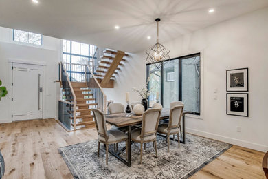 Example of a minimalist dining room design in Calgary