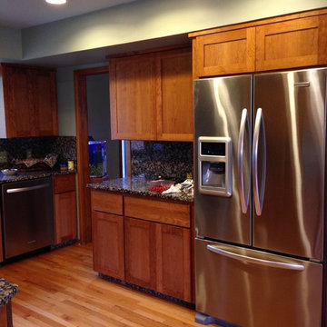 Before the cabinets were refaced a larger fridge had been purchased, and to fit