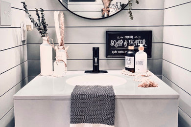 Example of an arts and crafts powder room design in Other