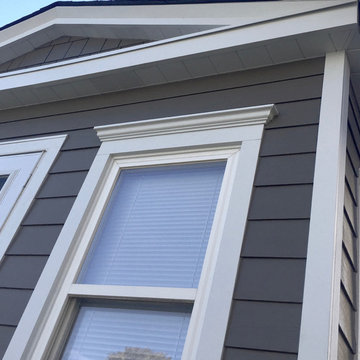 Chicago, IL Bungalow Siding Replacement with Dark Brown Siding