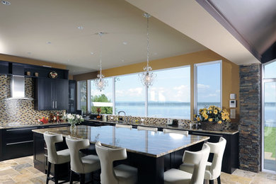 Example of a large transitional u-shaped multicolored floor open concept kitchen design in Ottawa with stainless steel appliances, black cabinets, granite countertops, multicolored backsplash, mosaic tile backsplash and an island