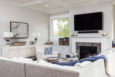 Design ideas for a large transitional open concept family room in DC Metro with grey walls, a standard fireplace, a stone fireplace surround and a wall-mounted tv.