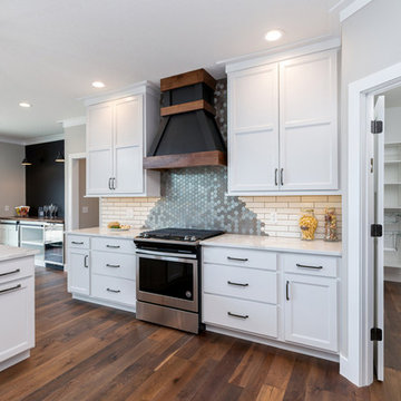 McCoy Homes Quad Cities Kitchen With White Cabinets and Matte Black Accents