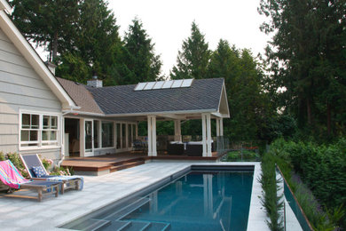 Inspiration for a beach style backyard full sun garden for summer in Vancouver with natural stone pavers.