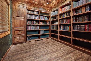 Inspiration for a small timeless laminate floor and brown floor home office library remodel in Edmonton with green walls