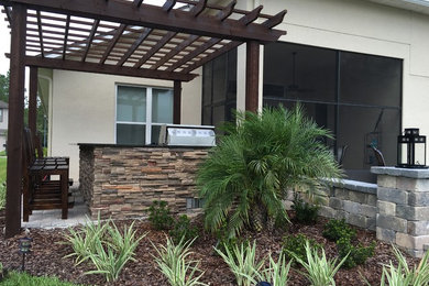 Backyard patio, firepit, pergola and summer kitchen