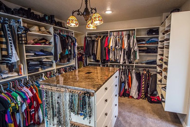 Large elegant porcelain tile closet photo in Denver with raised-panel cabinets and light wood cabinets