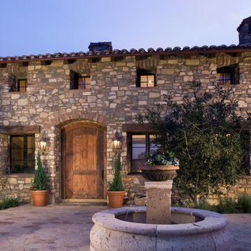 Countryside Villa With Rustic Stone Exterior and Fountain