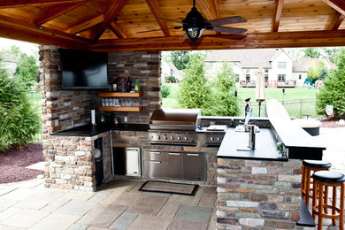 Patio kitchen - stone patio kitchen idea in Philadelphia
