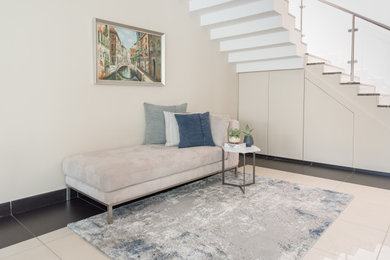 Living room - large contemporary ceramic tile living room idea in Other