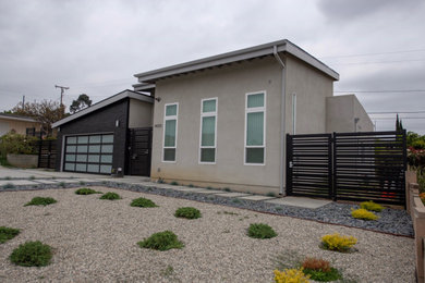 Mid-sized modern gray two-story stucco house exterior idea in Los Angeles with a shed roof