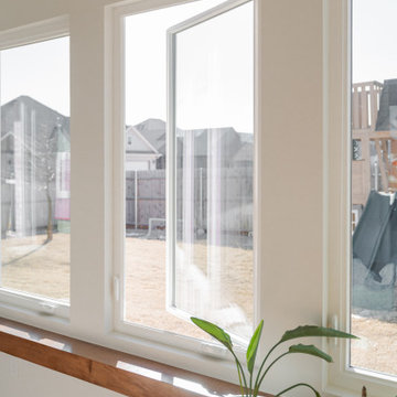 Arched Built-Ins Meet Terracotta Tile in a Light-Filled Sunroom Addition