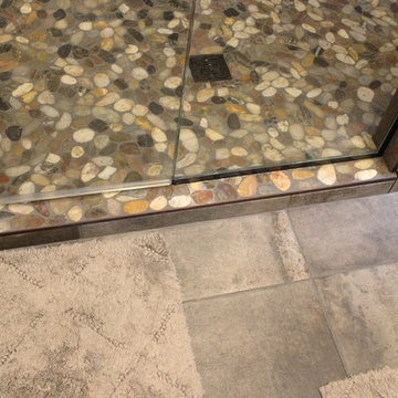 Moline, IL Bath Remodel With Gray Stained Cherry Vanity and Pebble Tiled Shower