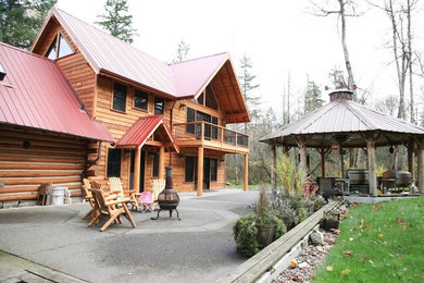 Inspiration for a large rustic brown two-story wood exterior home remodel in Seattle