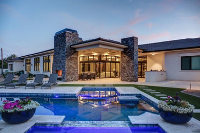 Inspiration for a large contemporary backyard tile and rectangular lap hot tub remodel in Phoenix