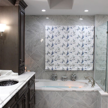 Luxurious Spa Master Bath With Grain Stain Custom Cabinetry & Built-In Bathtub