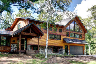 Example of a mountain style home design design in Minneapolis