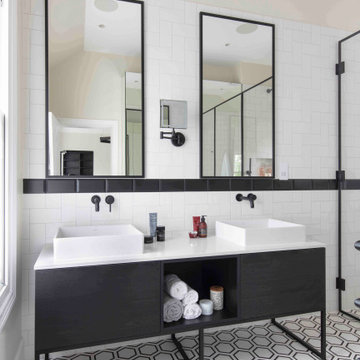 Modern vanity unit with black framed mirrors