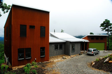 Inspiration for a contemporary mixed siding exterior home remodel in Other
