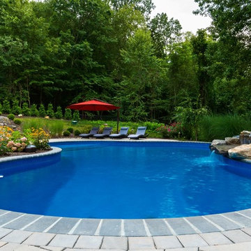 Vinyl pool with Waterfall, Landscape Lighting and Landscaping