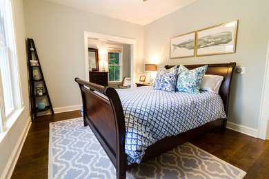Inspiration for a mid-sized transitional guest bedroom in Charleston with grey walls, dark hardwood floors and brown floor.