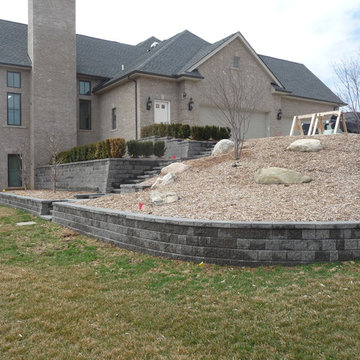 Tiered Unilock Pisa Retaining Walls with a Staircase & Paver Landings