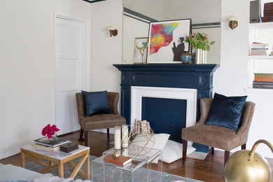 Living room - mid-sized transitional formal and open concept dark wood floor living room idea in Los Angeles with white walls, a standard fireplace, a wood fireplace surround and no tv