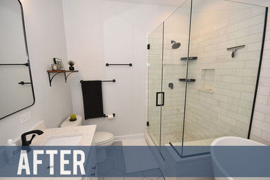 Inspiration for a mid-sized contemporary master white tile and ceramic tile ceramic tile and white floor bathroom remodel in Chicago with flat-panel cabinets, black cabinets, a one-piece toilet, white walls, a drop-in sink, granite countertops, a hinged shower door and white countertops