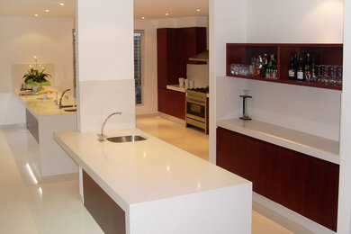 This is an example of a large contemporary single-wall open plan kitchen in Sydney.