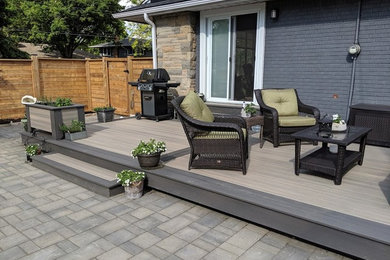Mid-sized arts and crafts side yard deck photo in Other with no cover
