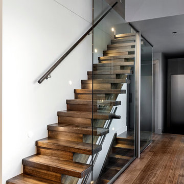 Timber Staircase from ground floor encased in glass