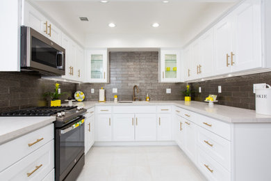 Kitchen pantry - large contemporary u-shaped ceramic tile and white floor kitchen pantry idea in Los Angeles with an undermount sink, shaker cabinets, white cabinets, quartz countertops, gray backsplash, subway tile backsplash, no island and white countertops