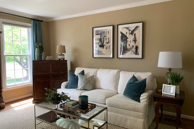 Inspiration for a large timeless formal and enclosed light wood floor and brown floor living room remodel in Baltimore with beige walls, no fireplace and no tv