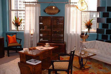 Example of a mid-sized trendy freestanding desk carpeted study room design in Other with blue walls