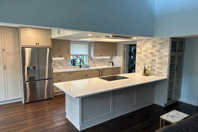 Mid-sized trendy galley eat-in kitchen photo in Austin with shaker cabinets, quartz countertops and subway tile backsplash